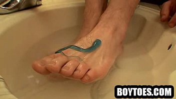 Preview 1 of Dhon Coshs - Amateur hunk washing and massaging his nice feet