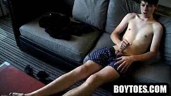 Preview 1 of Weak Up Her Son - Stud shows his feet and tugs on his cock on the couch