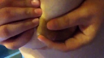 Preview 1 of New Rubber Rainfair Coat Wank - Milking my big tits