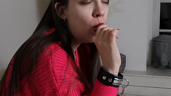 Preview 2 of Shemale Cuti - A girl in leather handcuffs sucks a candy
