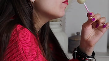 Preview 3 of Shemale Cuti - A girl in leather handcuffs sucks a candy
