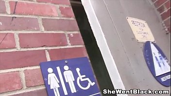 Preview 1 of Porn Star Seduces - Trashy redhead fucks a black cock in a public bathroom gloryhole