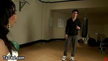 Preview 2 of Hostei Girl - Brunette tranny sucks dick and gives footjob in gym