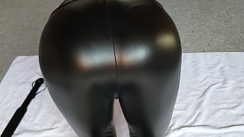 Preview 1 of Dans Platu - Sissy boy in latex pants paddles his plugged ass