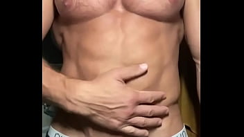 Preview 1 of Naked That - Big muscular body flexes and sprays lotion on his ripped big chest!