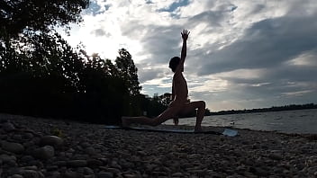 Preview 2 of Masagge Dh - Slender nudist boy does yoga nude on a naturist beach. Naked yoga video by Jon Arteen gay porn model