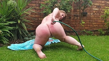 Preview 4 of Hot Fitness Fuck Video - Bbw with big tits shoving water hose up her fat pussy while being naked in the garden
