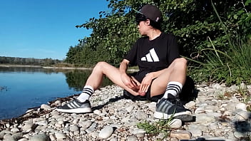 Preview 2 of 4cam Sex - Jon Arteen wanks outdoor on a pebbles beach,  the sexy twink wearing short shorts cums on his thigh,  and cumplay
