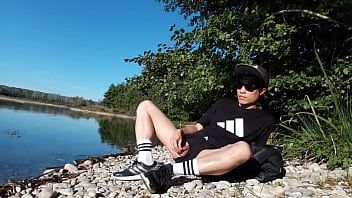 Preview 1 of 4cam Sex - Jon Arteen wanks outdoor on a pebbles beach,  the sexy twink wearing short shorts cums on his thigh,  and cumplay