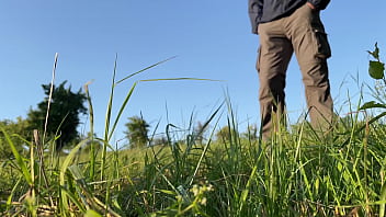 Preview 1 of Vibeos Xxxx Com - Sexy MILF with a huge ass in a dress bends over deeply so you can see her pissing in nature